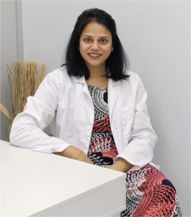 Dr. Prathima Adusumilli seated in consultation space